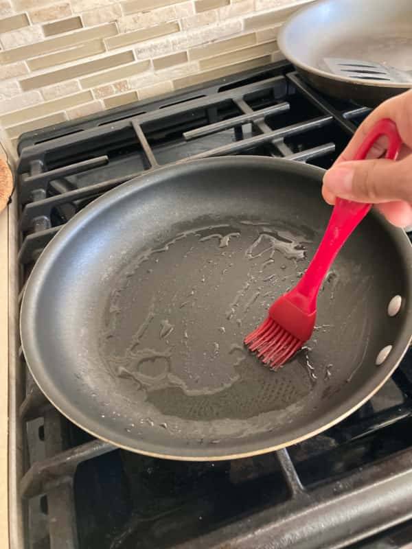 use oil and rub it on the nonstick pan